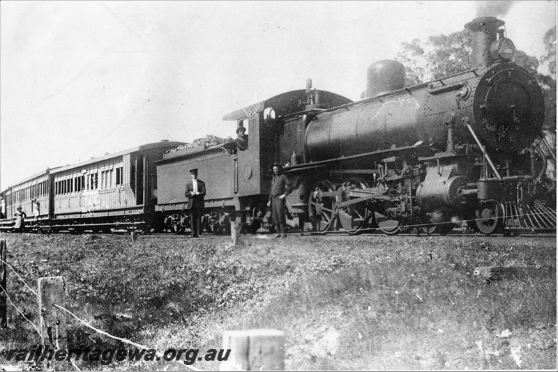 P20687
MRWA C class 14, passenger train, first cariage is a WAGR AD class carriage with a brake compartment, view along the train, crew standing in front of the loco, MR line but  location unknown
