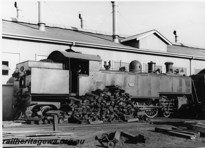 P20801
DM class 583, waiting to be lit up, pile of firewood, shed, East Perth, ER line, rear and side view
