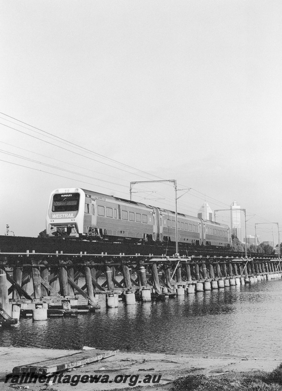 P20867
Three car Australind railcar set on a Down service on the Bunbury Bridge, SWR line the Bunbury Bridge, view of the whole train on the bridge 
