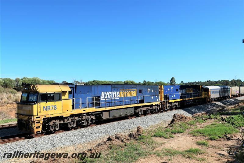 P21006
Pacific National NR class 78 in the yellow and blue livery double heading with another NR class on a south bound freight train passing through Hazelmere.
