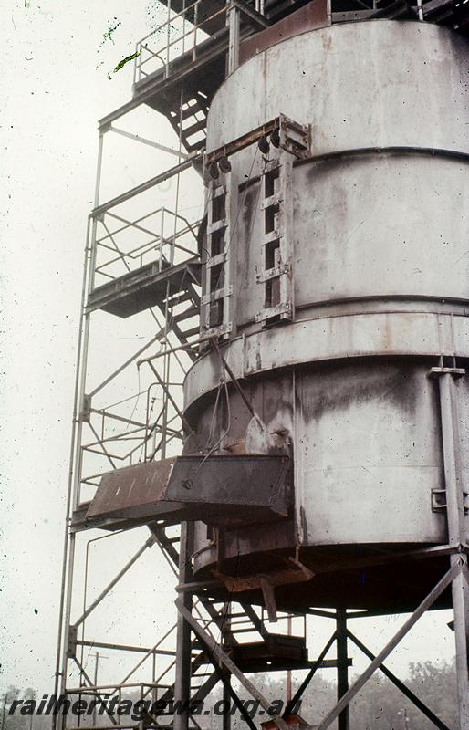 P21058
1 of 3 views of the cylindrical steel coal stage at Collie, BN line, trackside view  showing the coal chute
