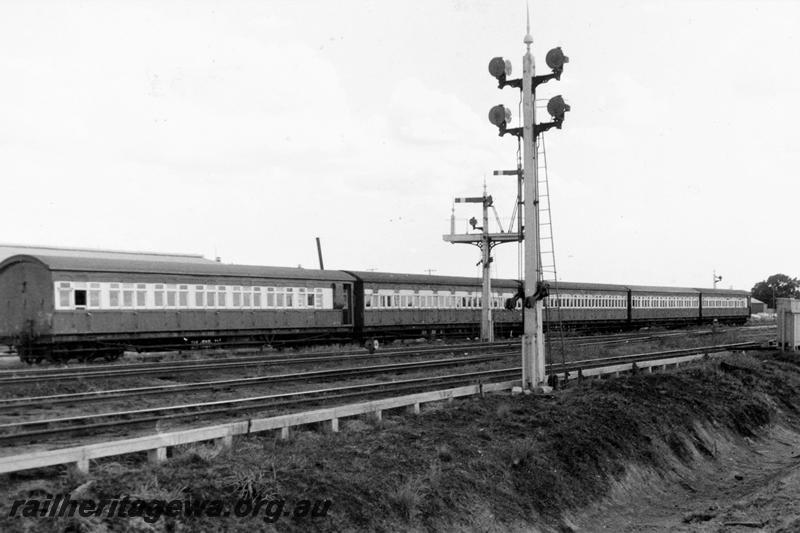 P21103
Rake of suburban passenger carriages, AU class !st class suburban brake carriages at each end  and AW 1st class suburban carriages in the middle, bracket signals, light signals, tracks, Midland Junction, end and side view from track level
