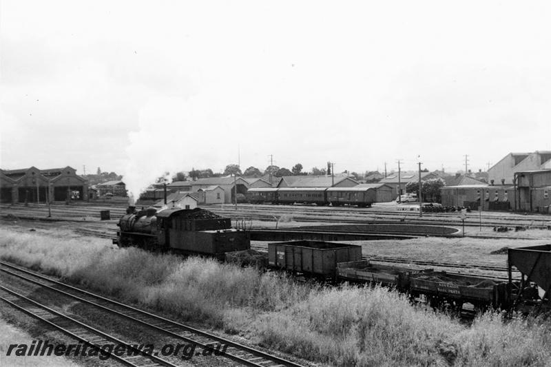 P21120
PMR class 732, shunting ash and coal wagons, rake of carriages, loco sheds, turntable, tracks, west end of East Perth running sheds, ER line, side and rear view of train
