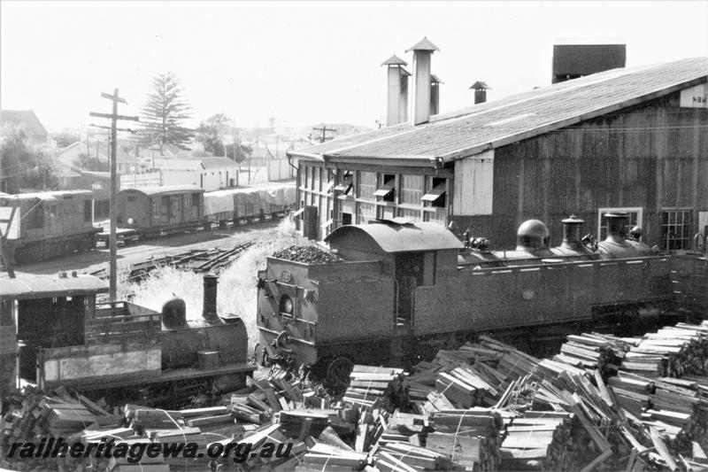 P21122
H class 18, another steam loco, diesel hauled goods train with a ZBA class brakevan, roundhouse, bundles of wood, Bunbury, SWR line, rear and side view
