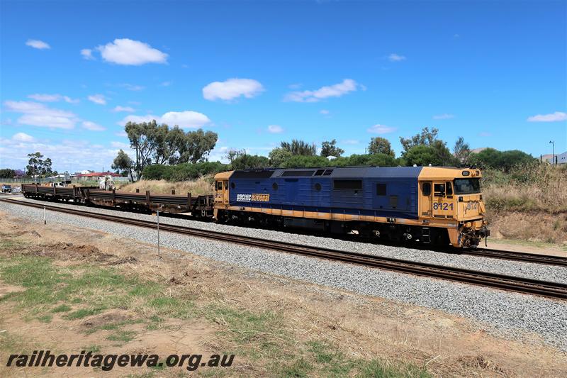 P21138
Pacific National 81 class 8121 in the blue and yellow livery hauls a rail train northwards through Hazelmere
