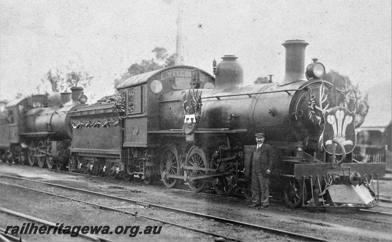 P21179
Decorated E class 325 double heading with E class 352 ready to haul the Priice of Wales' Royal Train from Perth to Northam  on the final leg of the WA tour.  East Perth, side and front view.
