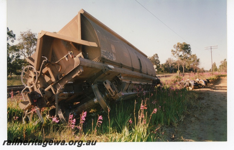 P21210
XC class wagon 21058, derailed beside track at junction of Jarrahdale spur and mainline, SWR line, c1990s, end and side view
