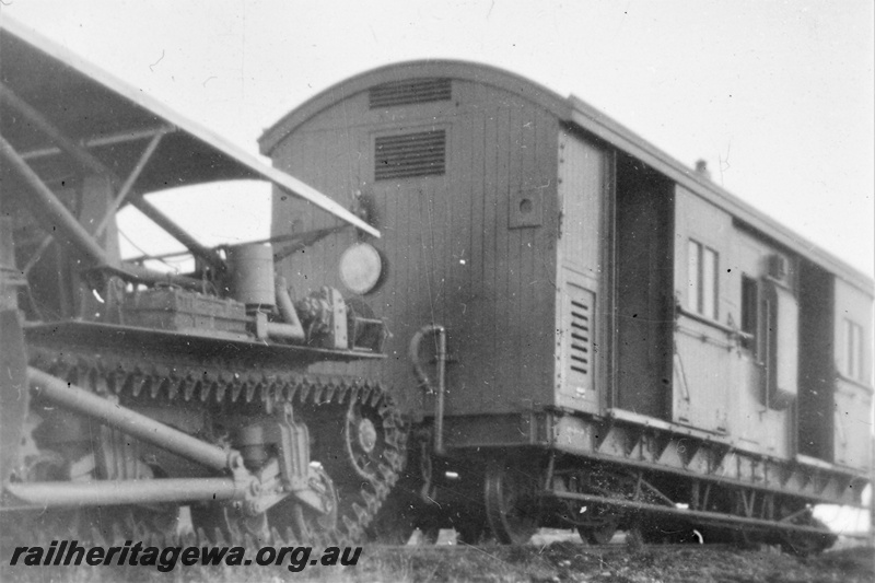 P21229
ZBA class brakevan, earth mover with tank tracks, end and side view from trackside
