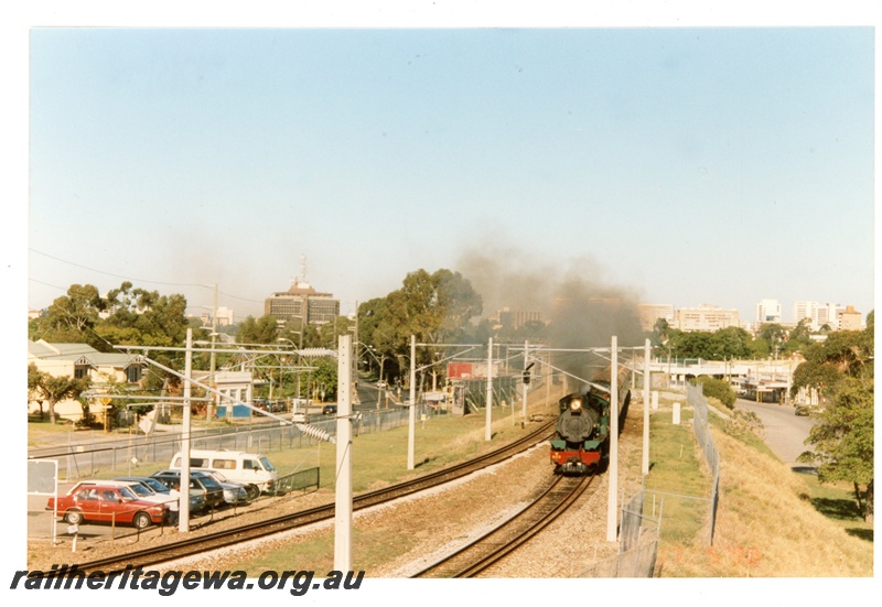 P21238
Hotham Valley W class 903 and a C Class haul passenger train through Mount Lawley. ER line
