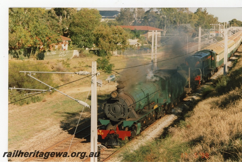 P21239
Hotham Valley W class 903 & a C class haul passenger train through West Leederville. ER line
