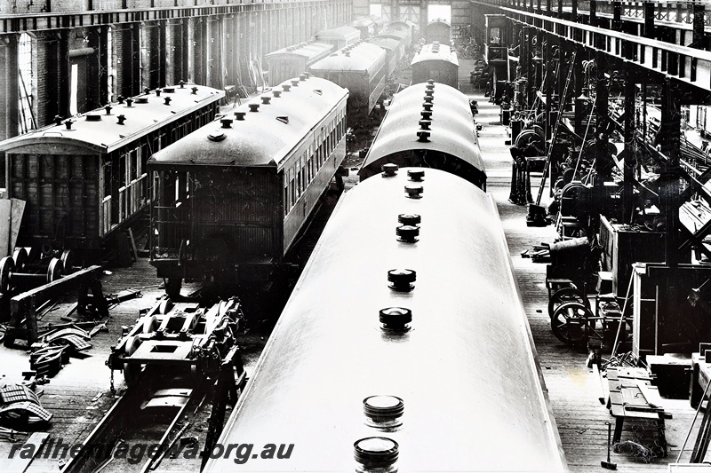 P21258
Multiple country passenger carriages being repaired in the Carriage Shop, various machinery, Midland Workshops, ER line, overview from elevated position, c1935
