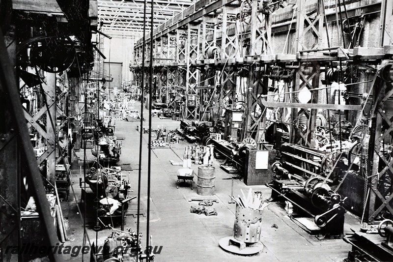 P21263
Interior view of the Machine Shop, line shafting, belt driven machinery, Midland Workshops, ER line, general view from elevated position, c1937
