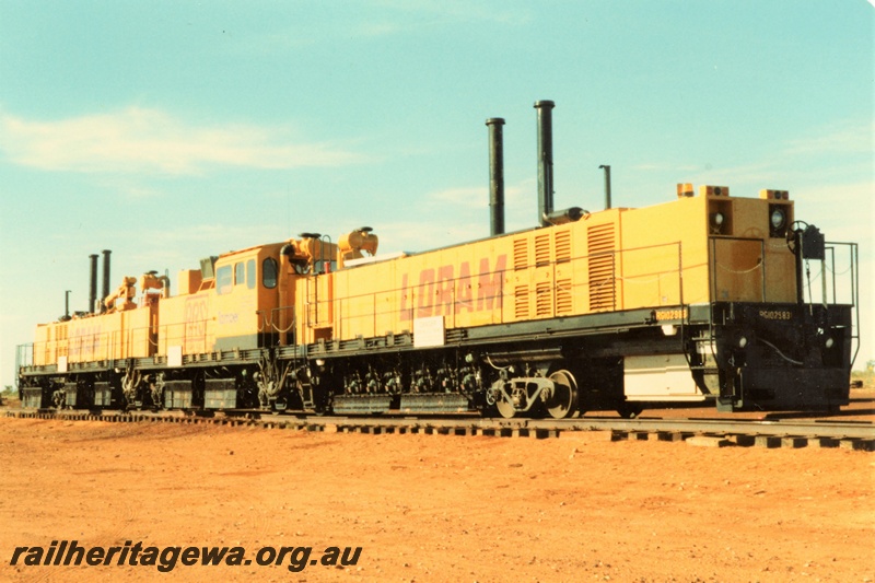P21324
Loram Australian Rail Service rail grinder, three component units on tracks, Port Hedland, side and end view
