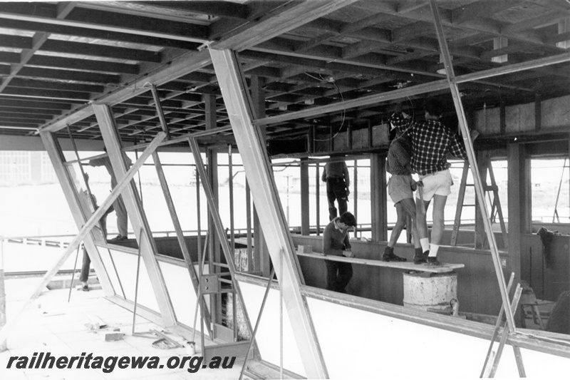 P21329
2 of 3 views of the construction of yardmaster's office and control Tower, at Leighton ,external view of the control room's sloping windows.
