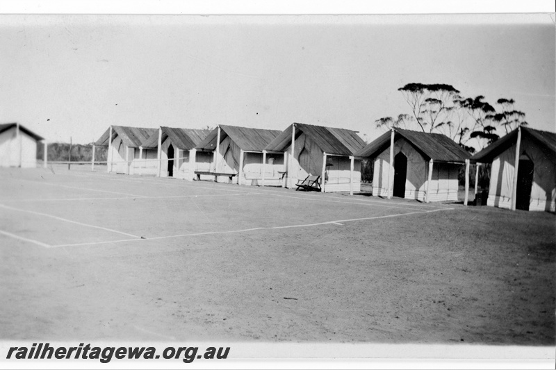 P21364
Camp buildings, bench, chair, tennis court, permanent way camp, Indarra deviation, NR line, c1936
