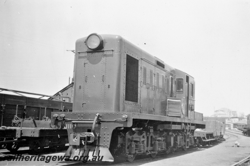 P21389
Yclass1110 with shunter's float, other wagons, Perth goods yard, ER line, end and side view
