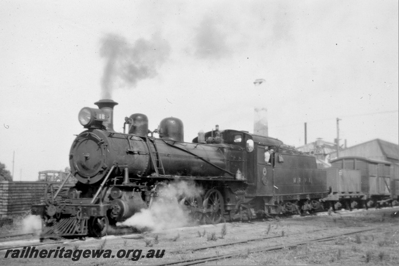 P21399
Midland Railway Co of Western Australia (MRWA) C class 18 on goods train, leaving depot, buildings, MR line, front and side view
