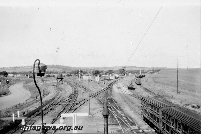 P21412
Junction of Eastern Goldfields and Great Southern Railways, points, tracks, diamond crossing, livestock wagons, wagons, signals, eastern end of Spencer's Brook station, ER line, view from elevated position 
