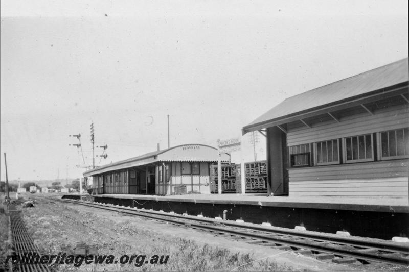 P21413
Station buildings, platform, tracks, bracket signals, rodding, station sign, livestock wagon, Spencer's Brook, ER line, view from trackside
