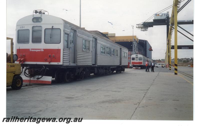 P21439
ADK class 681, other ADK and ADB class railcars, awaiting lifting on board nvoyager