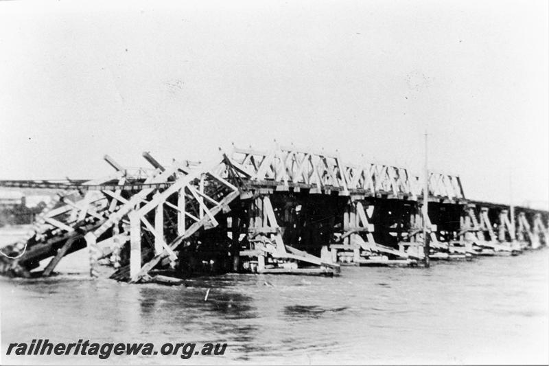 P21471
Wood trestle rail bridge over Swan River, partly washed away, Fremantle, ER line, view from North Fremantle bank 
