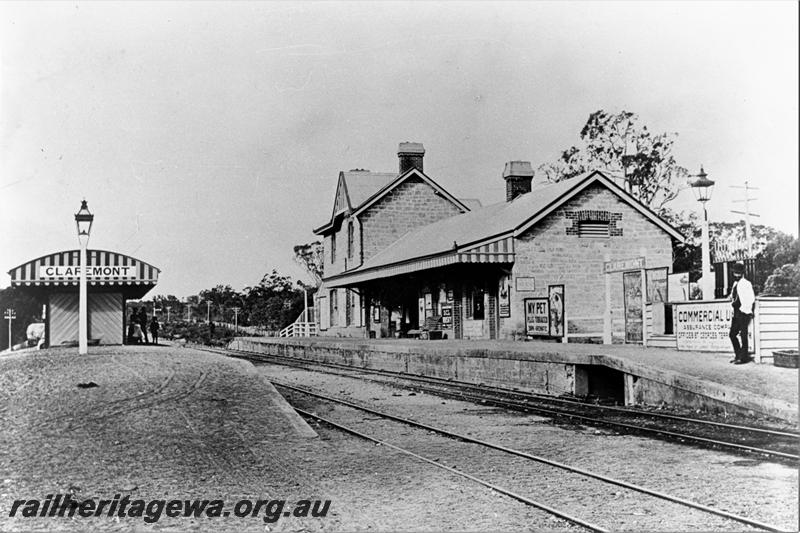 P21478
Station building, platforms, station signs, shelter shed, tracks, signal, passengers, Claremont, ER line, view from track level, c1895
