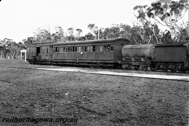 P21479
G class 117 on inspection train comprising tank wagon, passenger carriage and van, platform, station sign, two men standing next to van, one man in passenger car, Quarram, D line, side view
