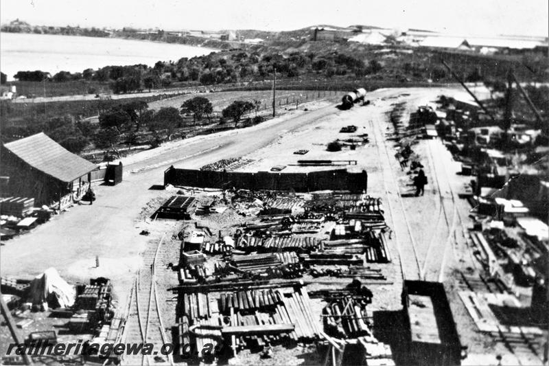 P21489
2 of 3 views of the Colonial Sugar Refineries plant at the end of the Rocky Bay line in Mosman Park, elevated view looking west  of the plant under construction, shows railway lines entering the site, .c1929
