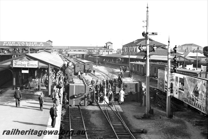 P21514
Scene after collision and derailment of N class 85 and N class 203, both locos on side, rakes of carriages, platforms, canopies, 