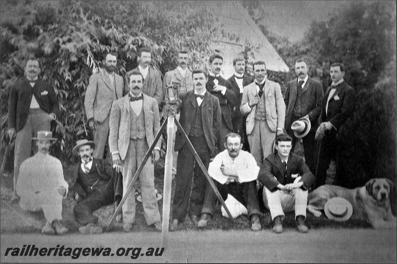 P21536
Group photo of WA Govt Railways - Engineer for Existing Lines Office - Professional Staff. Standing (left to right): DL Beetson, AJ Foster, G Bernberg, H McNeill, EE Rennick, P Bindley, C Ware, H Sergeant, G Farnsworth, MF O'Reilly, CB Douglas. Seated (left to right): WA Fenton, F Seaborn, R Lundon, AN Davies, dog.
