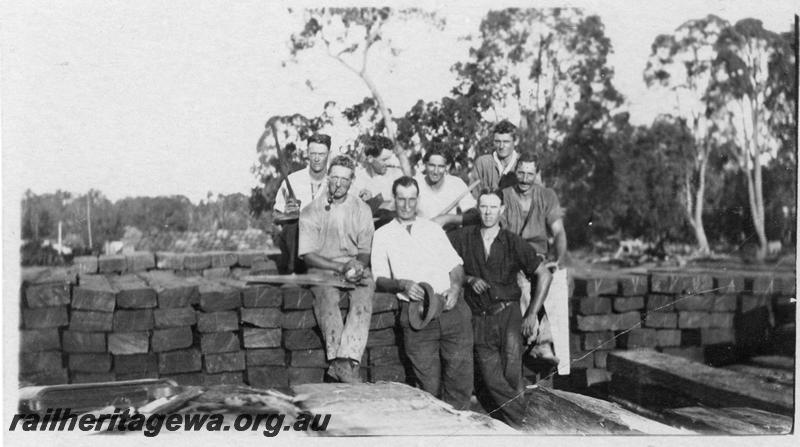 P21543
4 of 20 Construction Scenes of Third Beechina Deviation between Wooroloo and Chidlow ER line c1920s, sleeper adzing and boring gang, pile of sleepers
