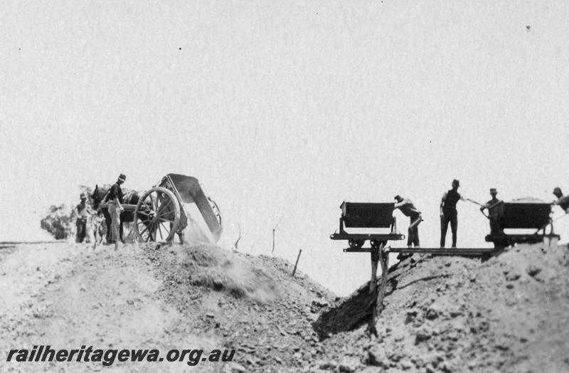 P21548
9 of 20 Construction Scenes of Third Beechina Deviation between Wooroloo and Chidlow ER line c1920s, horse drawn cart, mining wagons tipping dirt, workers, Allan's Bank
