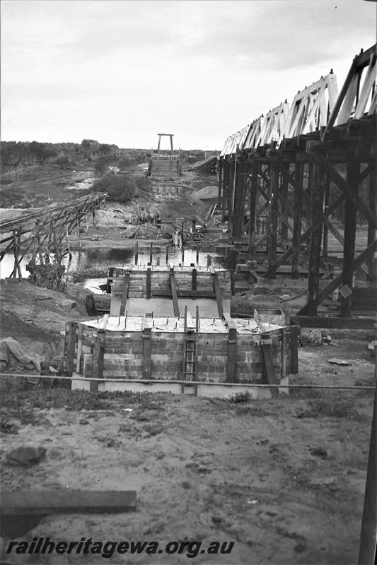 P21570
Construction of bridge foundations, Greenough River, Eradu, NR line, view from bank
