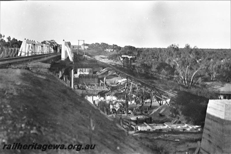 P21574
Wooden bridge over Greenough River, bridge foundations under construction, construction rail, Eradu, NR line, view from bank
