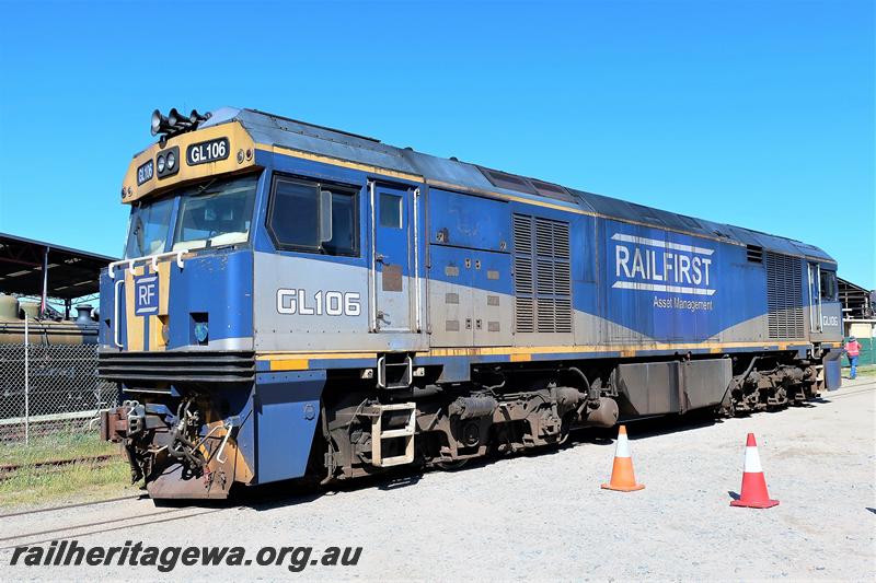 P21579 
Railfirst GL class 106 in the blue, grey and yellow livery passing through the site of the Rail Transport Musem en route to the plant of UGL, front and side view
