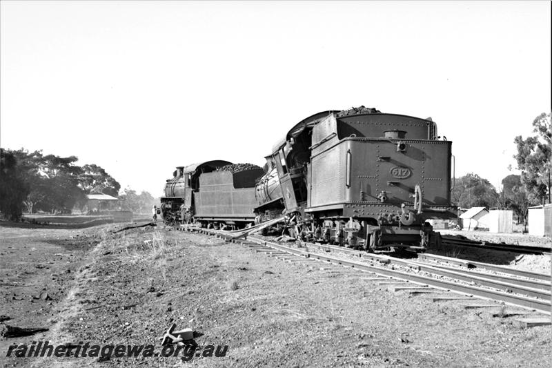 P21592
P class 517 and P class 510 locos, both derailed, tracks, buildings, onlooker, Popanyinning, GSR line, side and rear view from track level. Date of derailment 8/2/1953
