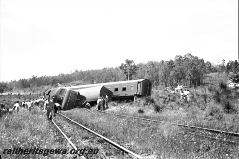 P21595
Derailment, X class 1005 on its side, passenger carriages across tracks, near Parkerville, ER line,  onlookers, trackside view
