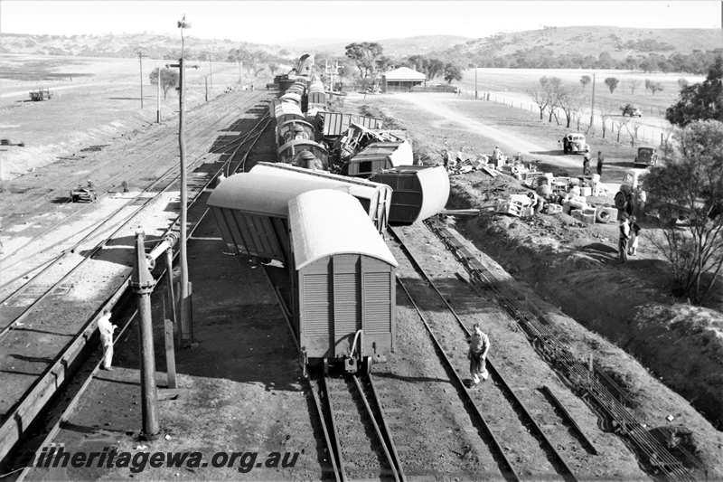 P21602
Scene of collision between goods trains, vans and wagons derailed, onlookers, water column, points, sidings, bracket signals, Spencers Brook, GSR line, view from elevated position
