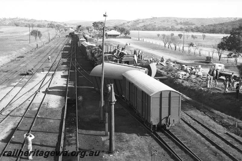 P21603
Scene of collision between goods trains, vans and wagons derailed, onlookers, flat top motor lorry, water column, points, sidings, bracket signals, Spencers Brook, GSR line, view from elevated position
