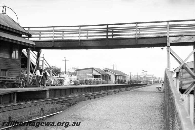 P21606
Station, platforms, station buildings, seats, bicycles, passengers, overhead footway, bracket signals, West Perth, ER line, view from track level
