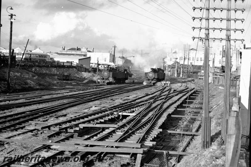 P21614
Scissors crossover assembly, two tank locomotives, pointwork, tracks, signals, telegraph poles, trackside rodding, Perth, ER line, view from trackside
