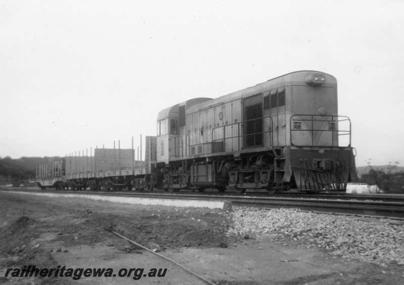 P21648
H class 4, hauling flat wagons with bolsters, Toodyay, Avon Valley line, side and front view from trackside
