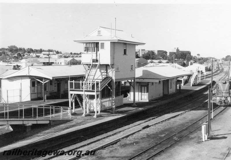 P21678
RA class 1911, shunting, platforms, station buildings, pedestrian ramp, signal box, overhead footbridge, sidings, Subiaco, ER line, view from elevated position
