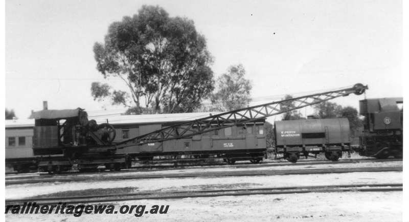 P21707
Steam crane, workers train behind including VC class 5105 and JA class wagon, Midland, ER line, view form trackside
