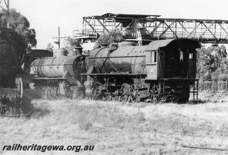 P21887
W class 936, V class loco without tender, another steam loco (part only), gantry crane, on scrap road, Midland, ER line, side and end view
