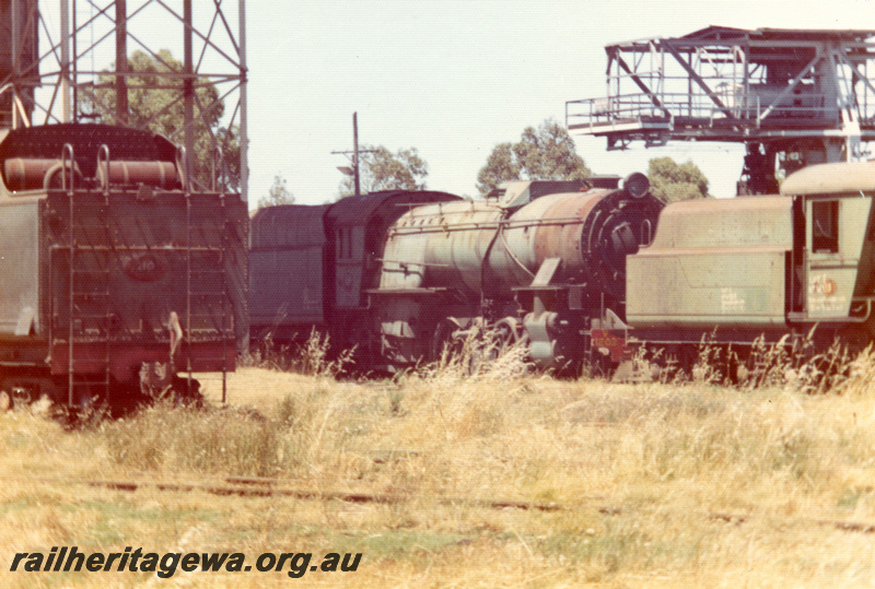 P21891
V class 1210, W class 939, V class 1203, on scrap road, tower, gantry crane, at loco depot, Midland, ER line, view from track level
