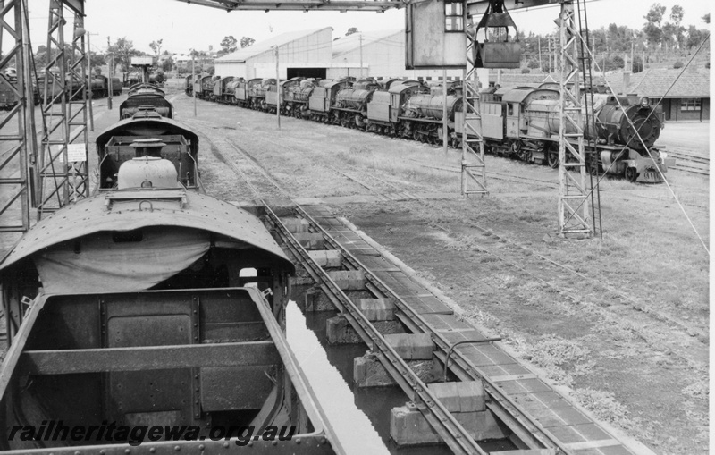 P21898
S class 547, on right, 25 other steam locos, on scrap roads, gantry crane, sheds,  loco depot, Collie, BN line, side and front view
