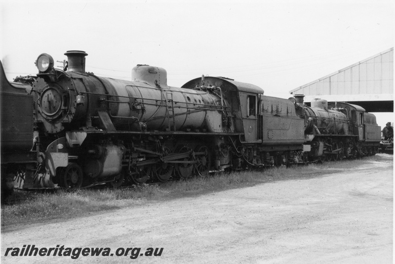 P21902
Two W class steam locos, on scrap road, loco depot, Collie, front and side views
