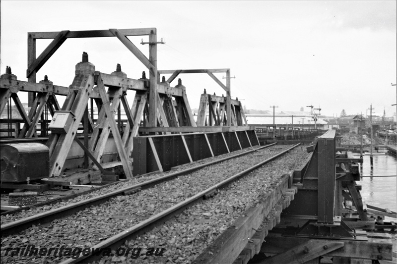 P21920
Wooden rail bridge, looking along the tracks to the south, bracket signals, port, Swan River, Fremantle, ER line
