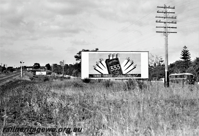 P22023
Lower quadrant signal, track, cigarette advertising hoarding, bus, Karrakatta, ER line, ground level view
